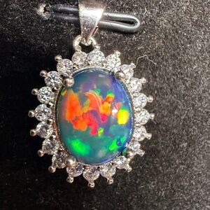 Ethiopian opal pendant with 18” silver snake chain